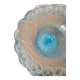 Plate on blue glass pedestal