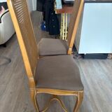 Four antique chairs in classic style with caning and upholstery.