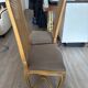 Four antique chairs in classic style with caning and upholstery.