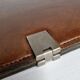 Underhand in saddle leather and vintage brushed metal