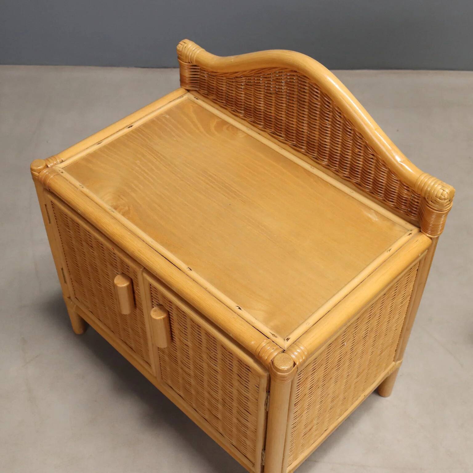 Pair of woven wicker bedside tables from the 1980s.
