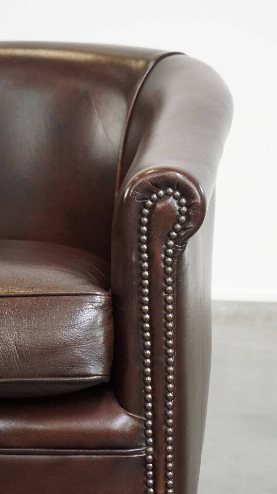dark cowhide club chair in English style