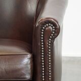 dark cowhide club chair in English style