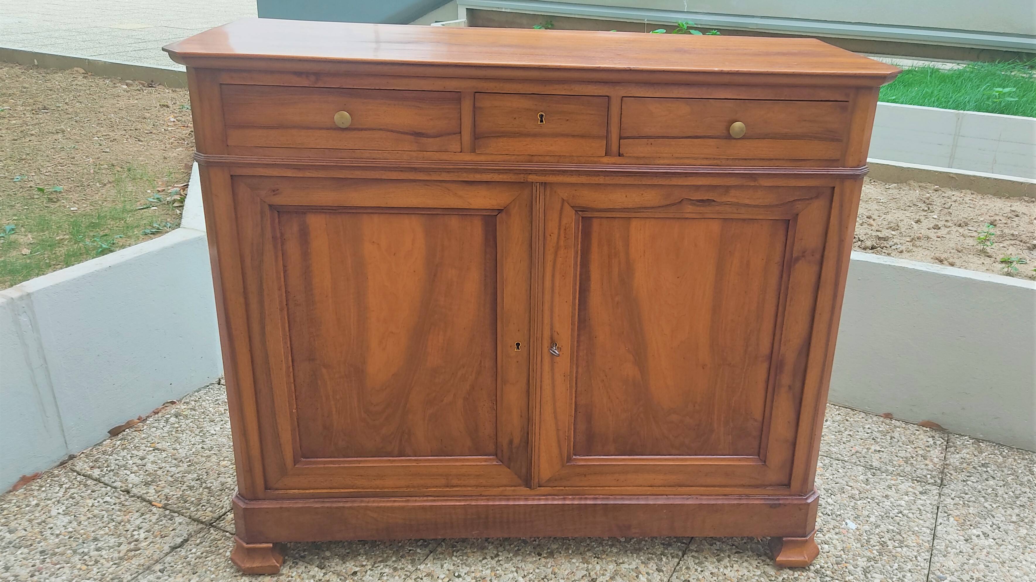 Solid walnut sideboard of the Napoleon III period, late nineteenth century, Louis Philippe style