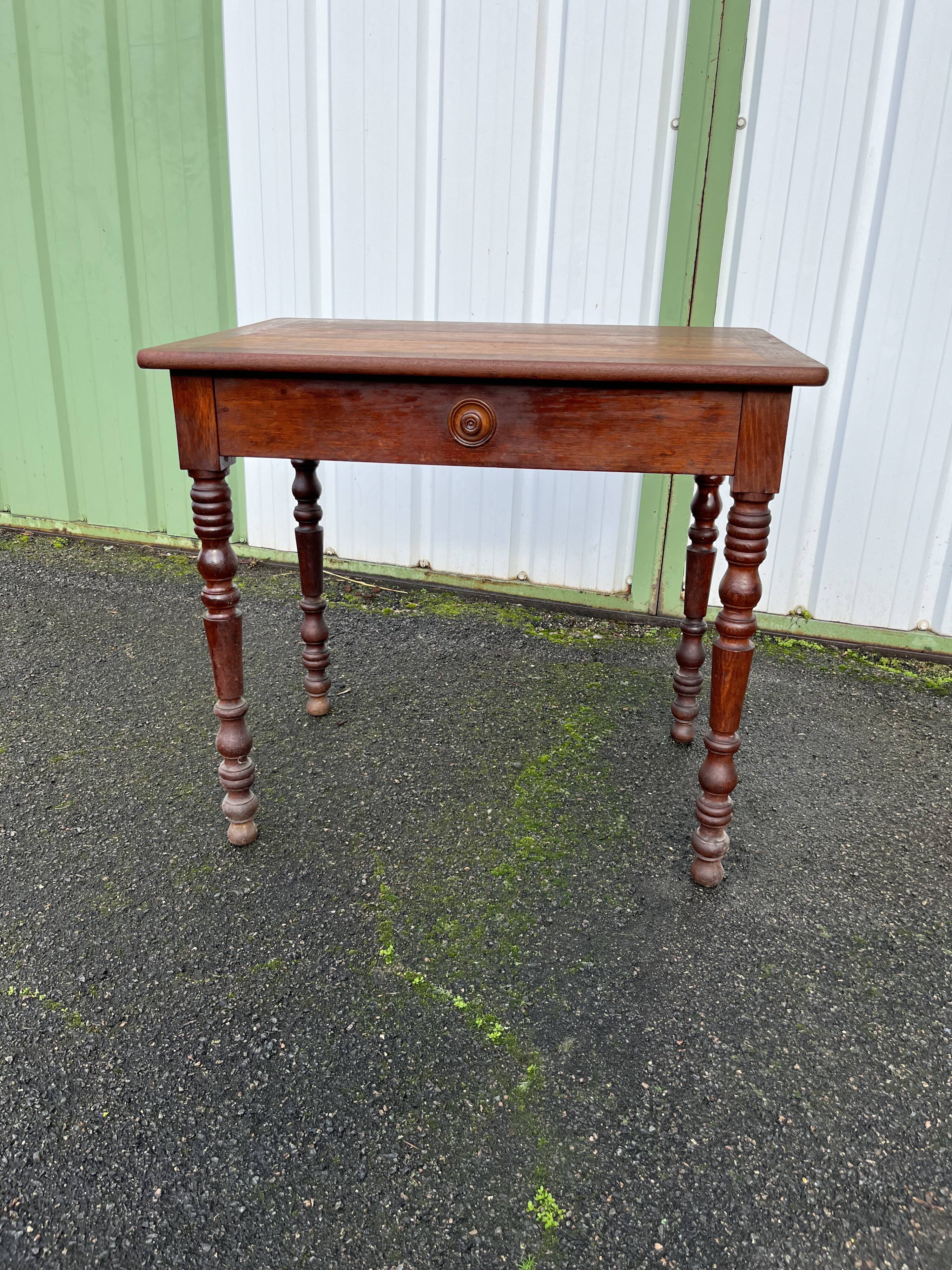 Wooden side table with turned legs