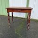 Wooden side table with turned legs