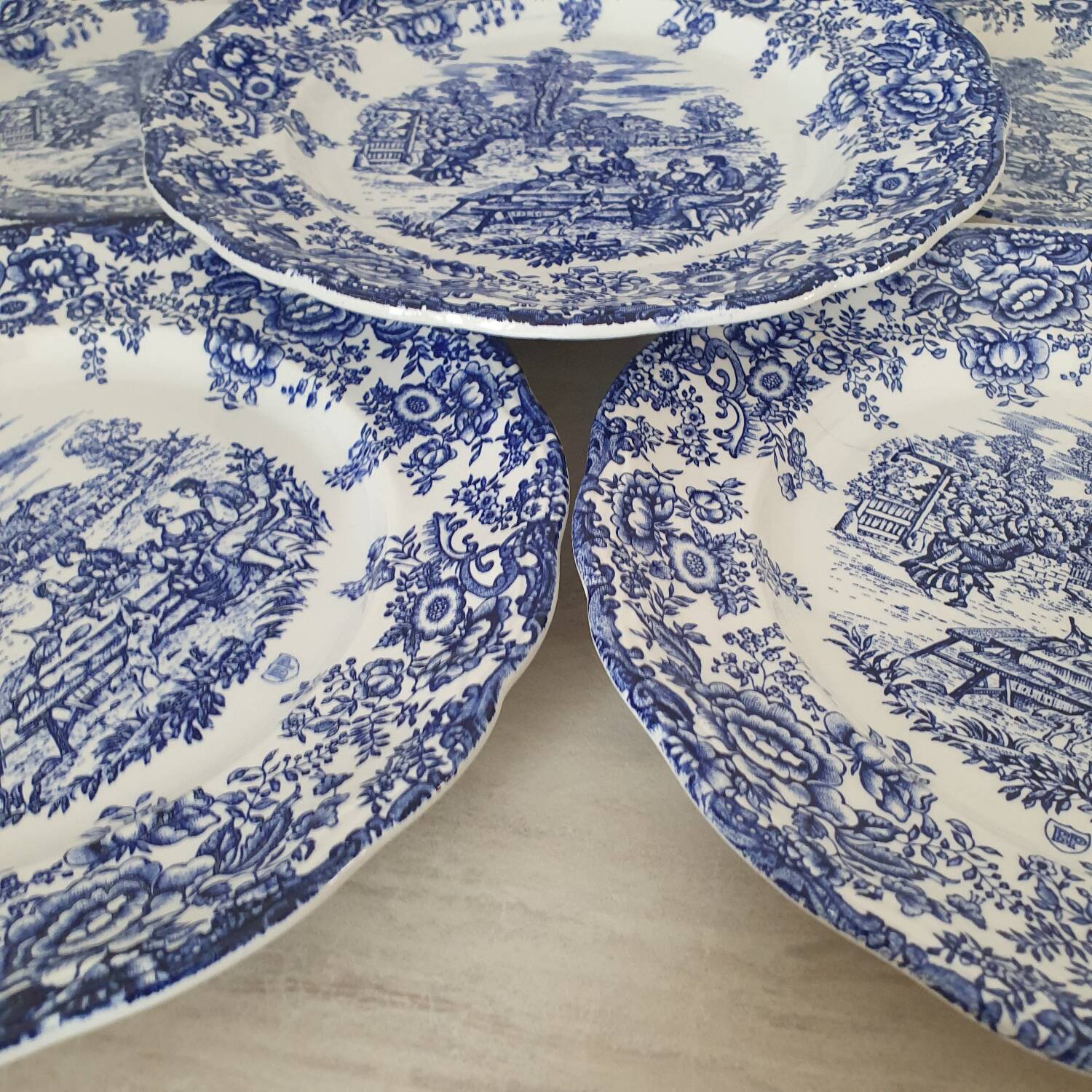 6 earthenware plates with floral and pastoral scene motifs