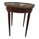 Gray marble mahogany pedestal table and brass gallery