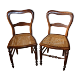 2 wooden chairs with canning seating