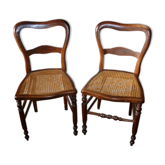 2 wooden chairs with canning seating
