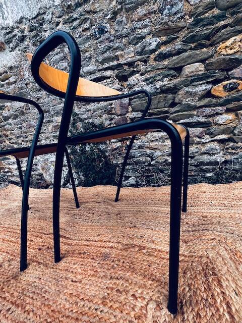 Pair of wooden and black metal chairs