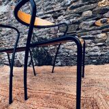 Pair of wooden and black metal chairs