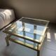 Vintage 1970s coffee table brass chrome Maison Jansen style with a top cover.
