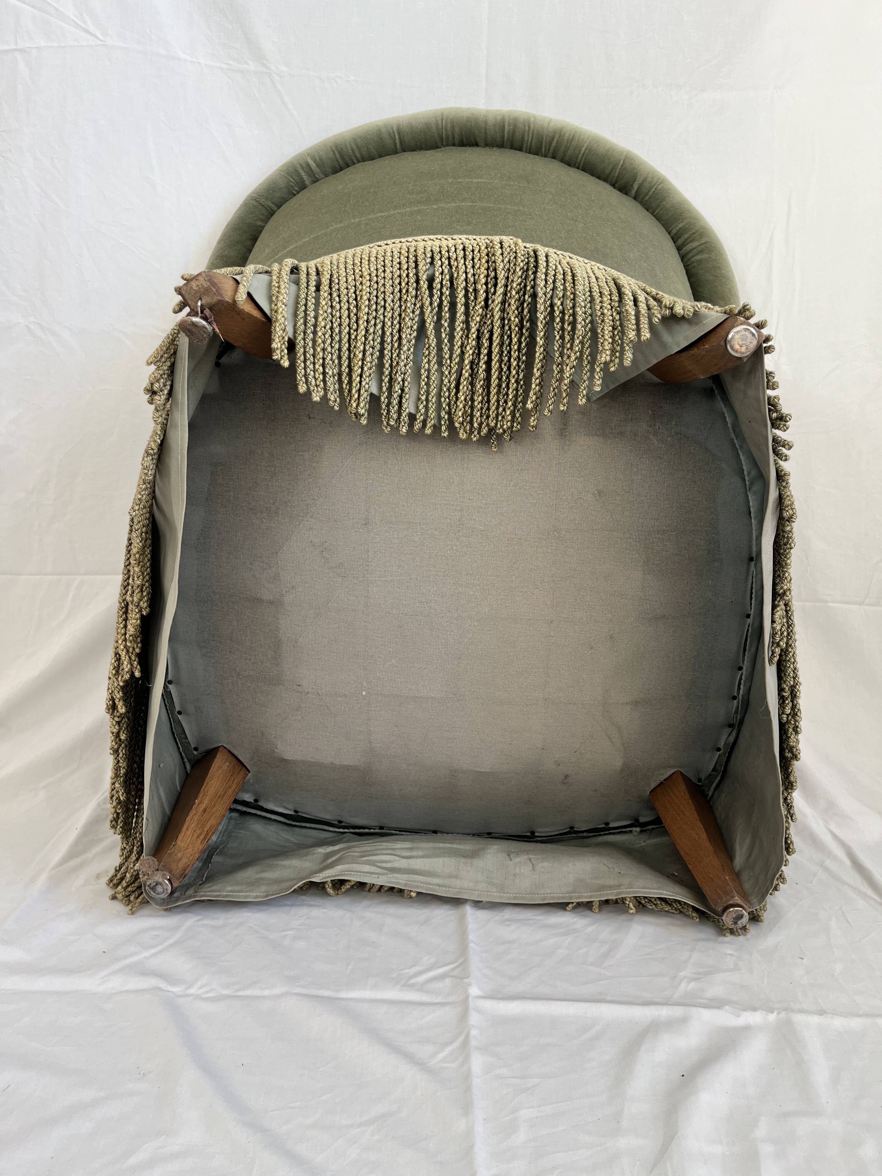 sage green toad armchairs with gold fringe