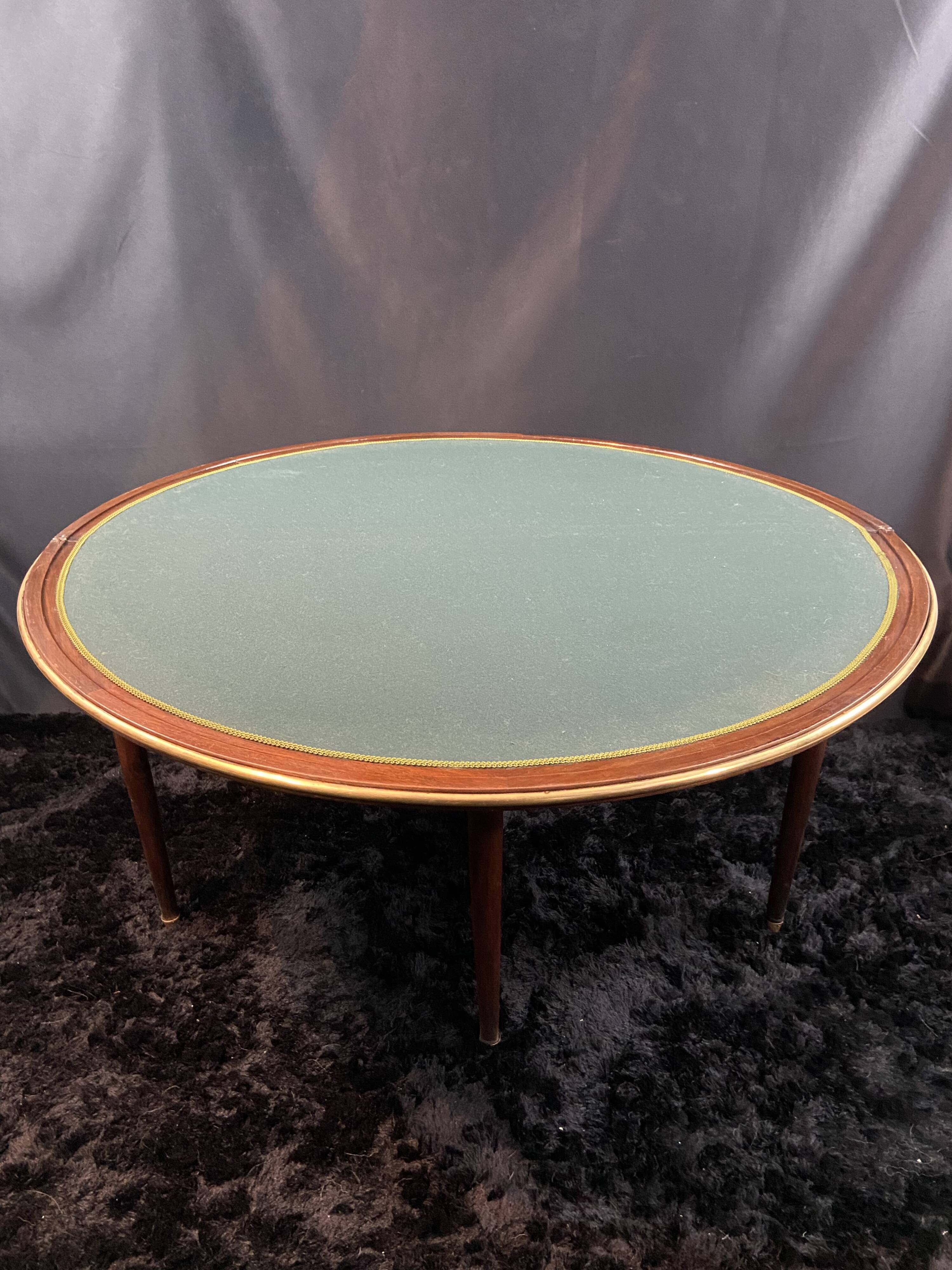 A Louis XVI period mahogany half-moon table forming a console/games table