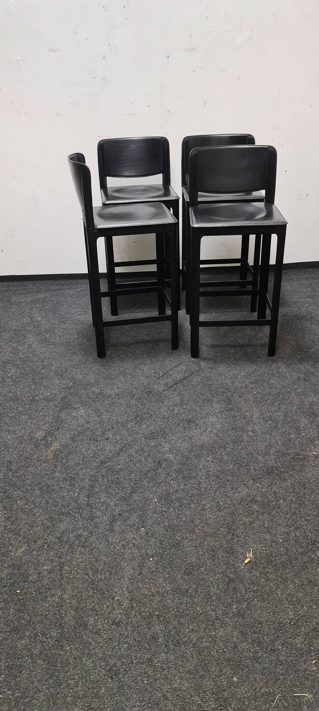 A set of four Italian leather bar stools by Matteo Grassi