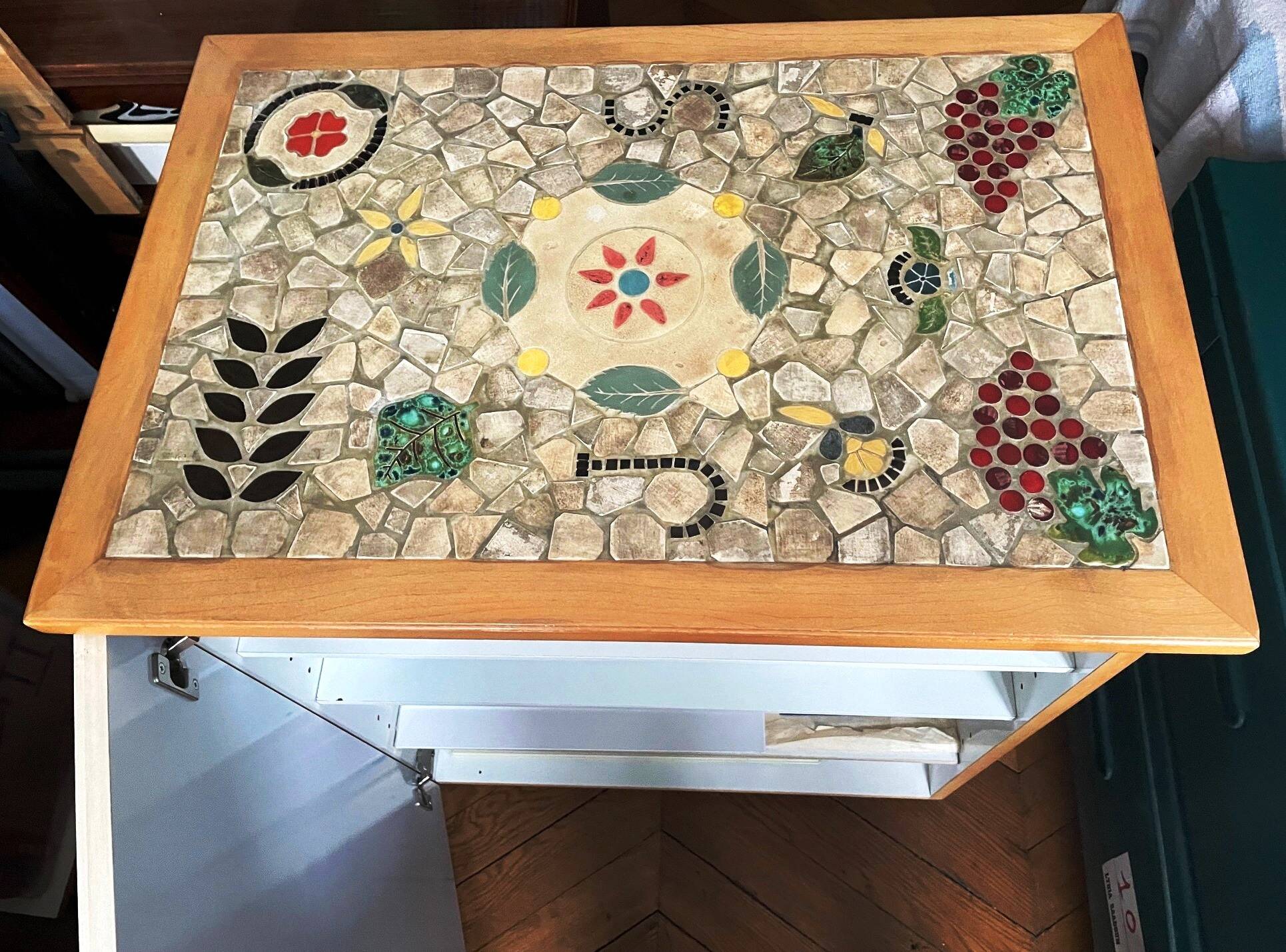 New oak storage furniture with a signed artisanal mosaic top.