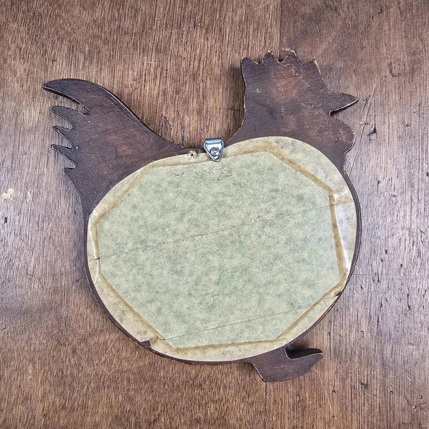 Vintage carved wooden chicken-shaped wall mirror.