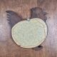 Vintage carved wooden chicken-shaped wall mirror.