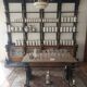 Antique Spanish pharmacy shelves and apothecary table (late 19th c.)