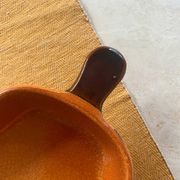 Ceramic dish in the shape of a pear.
