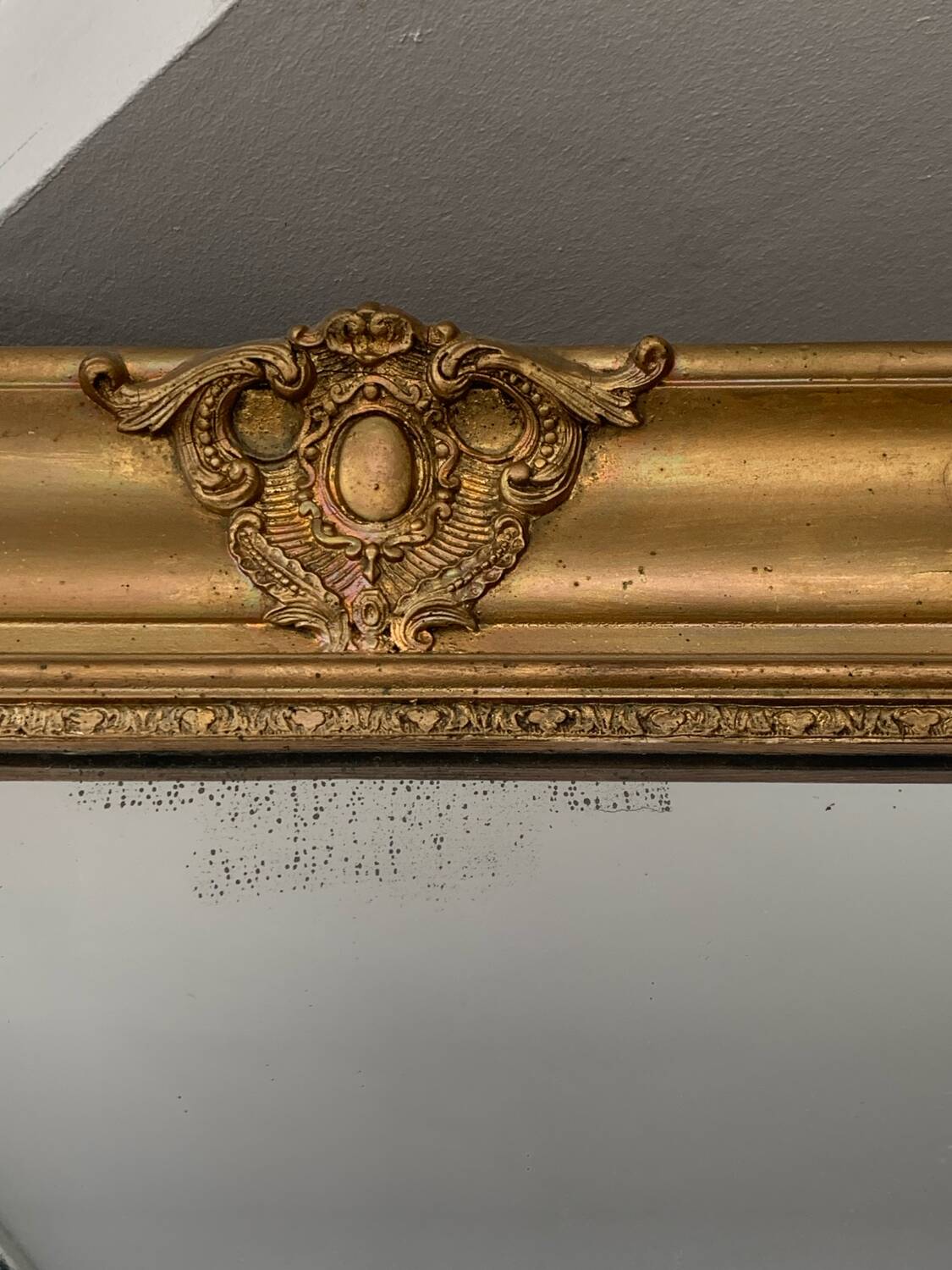 Old gilded mirror fireplace, 19th century restoration
