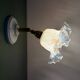Vintage tulip glass wall light in transparent, slightly pearlescent white.