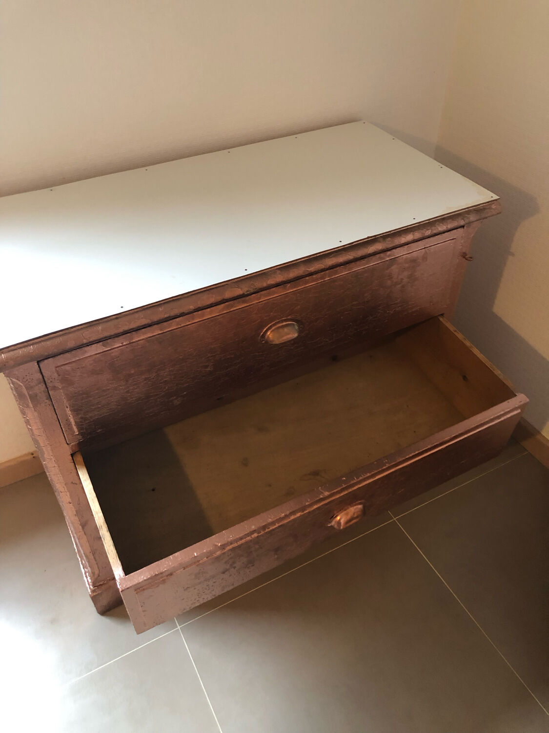 Old chest of drawers restored golden copper color