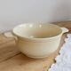 Vintage salad bowl in ivory faience from Chantilly with a rainbow trim.