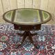 1950s English pedestal table in mahogany and leather top