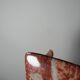 Pair of vintage wall sconces in faux red marble ceramic, 1990s.