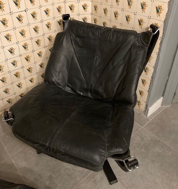 Leather Falcon armchair and footrest