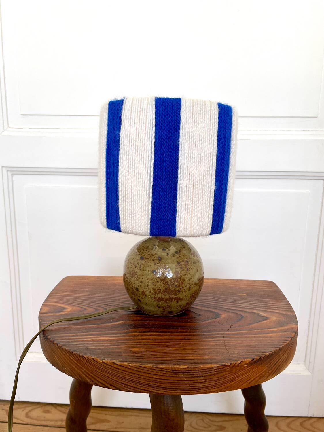 Vintage table lamp with pyrite sandstone base and striped wool lampshade