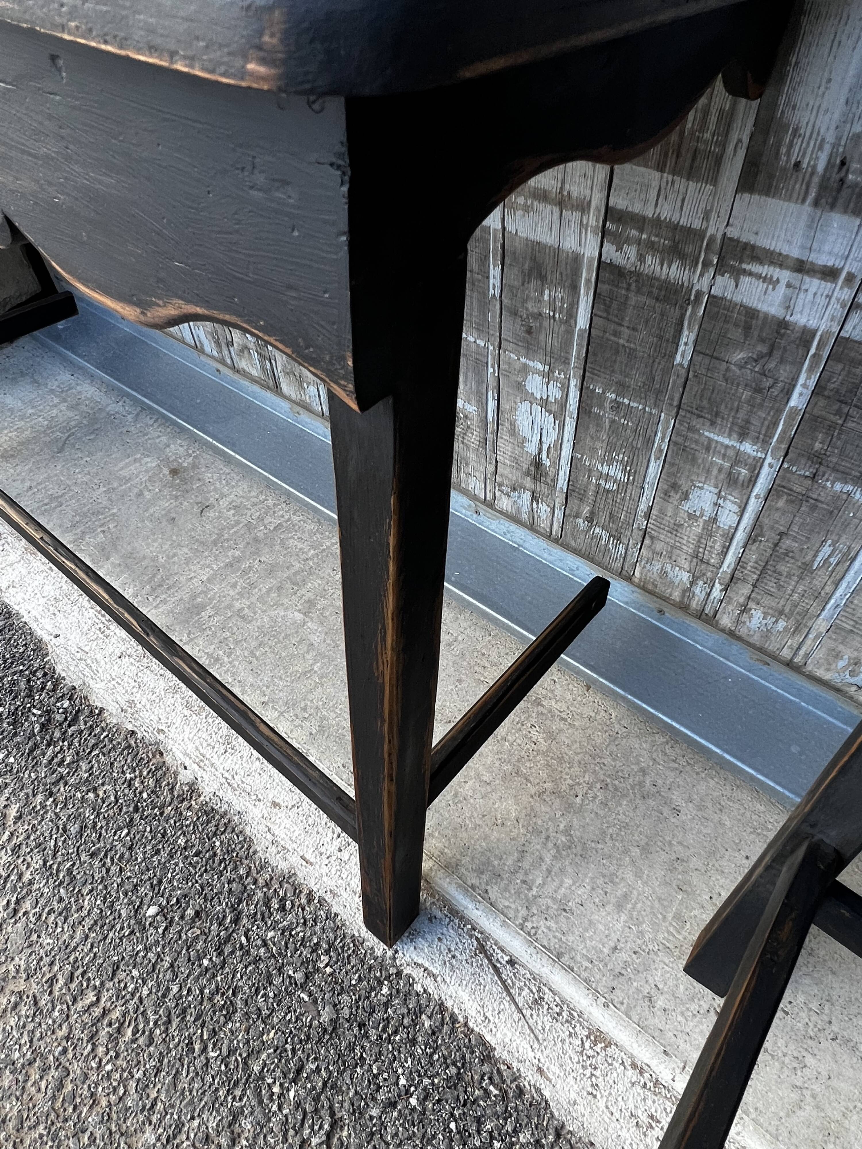 Pair of black patinated consoles