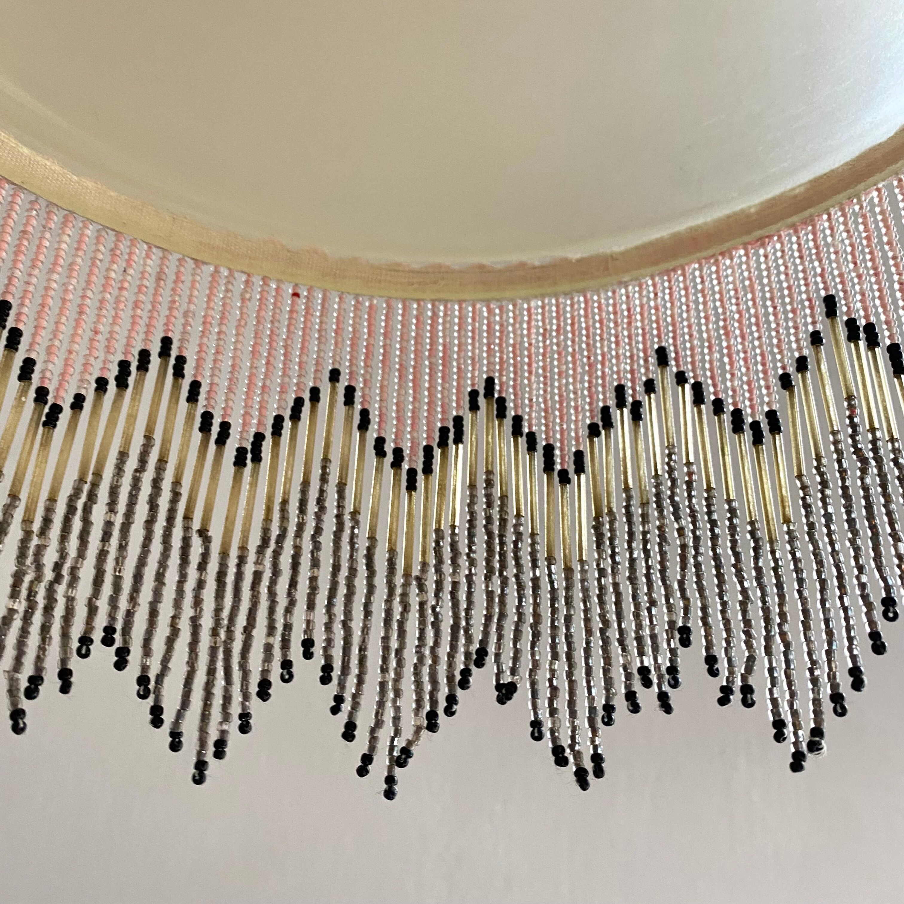 Pendant light in frosted glass and beads