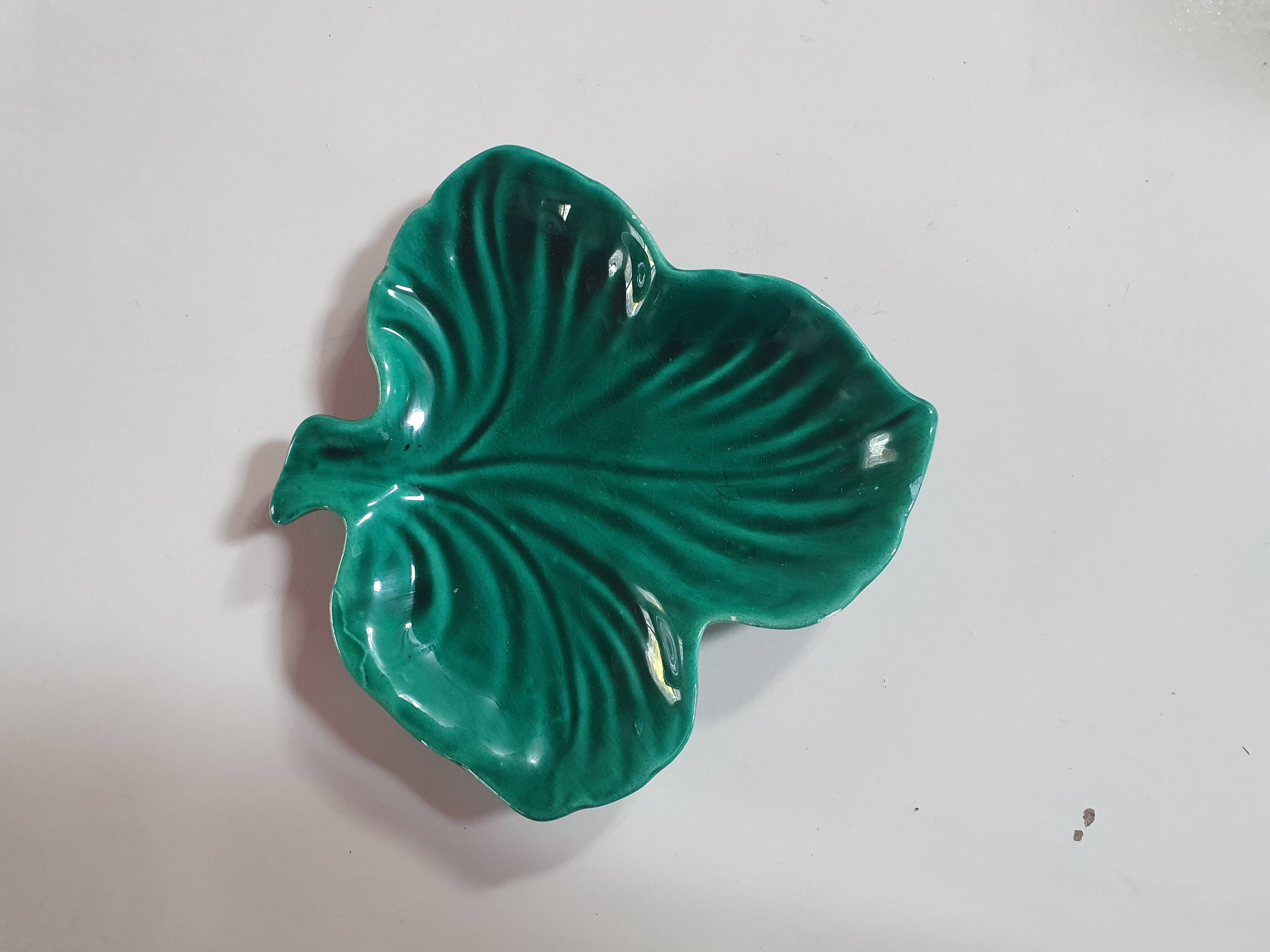 empty pocket cup leaf shape green ceramic slip, some chips on one edge