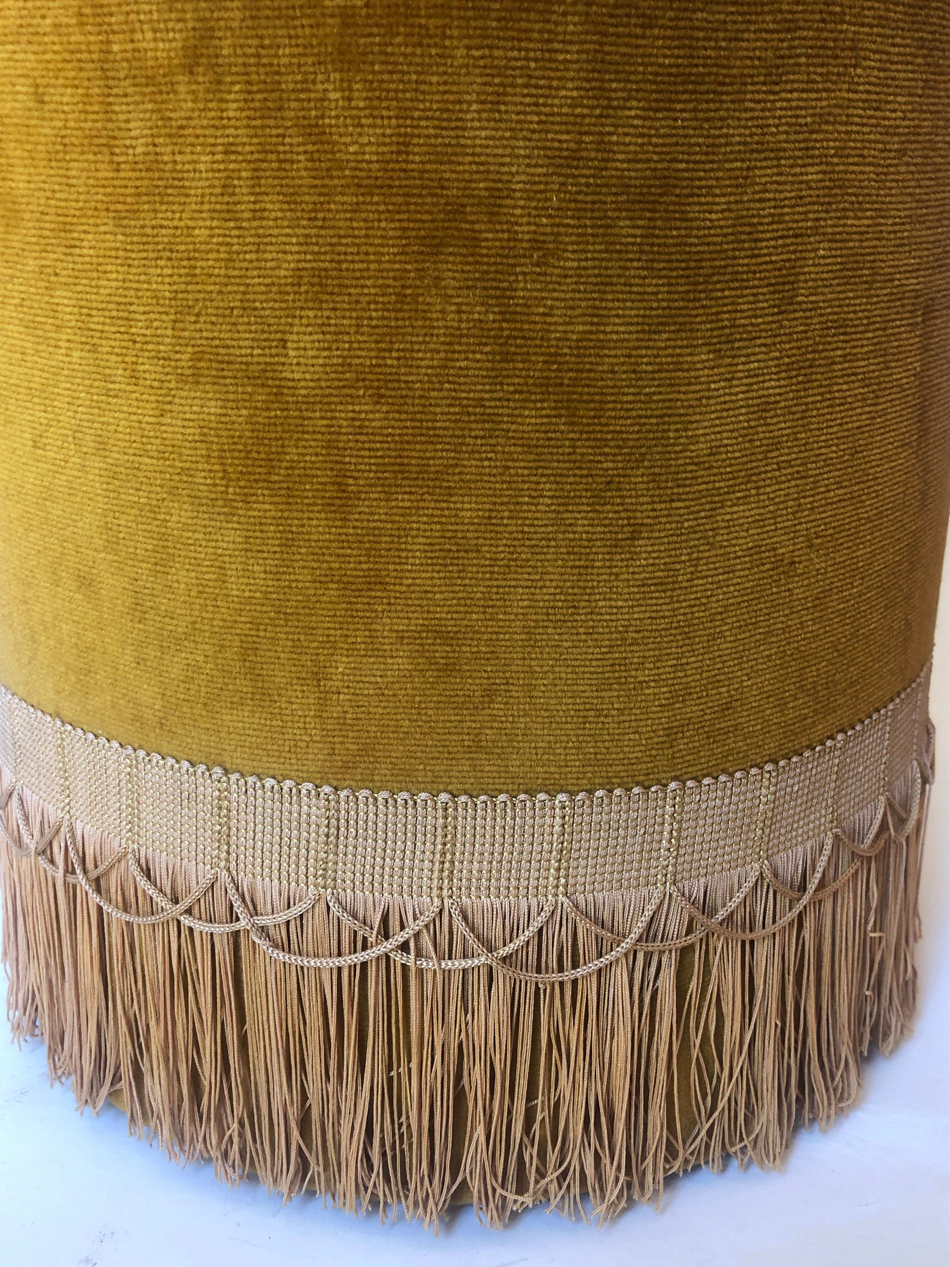 Velvet and fringed ottoman