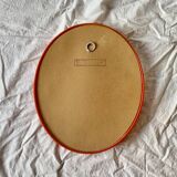 Vintage orange plastic oval wall mirror