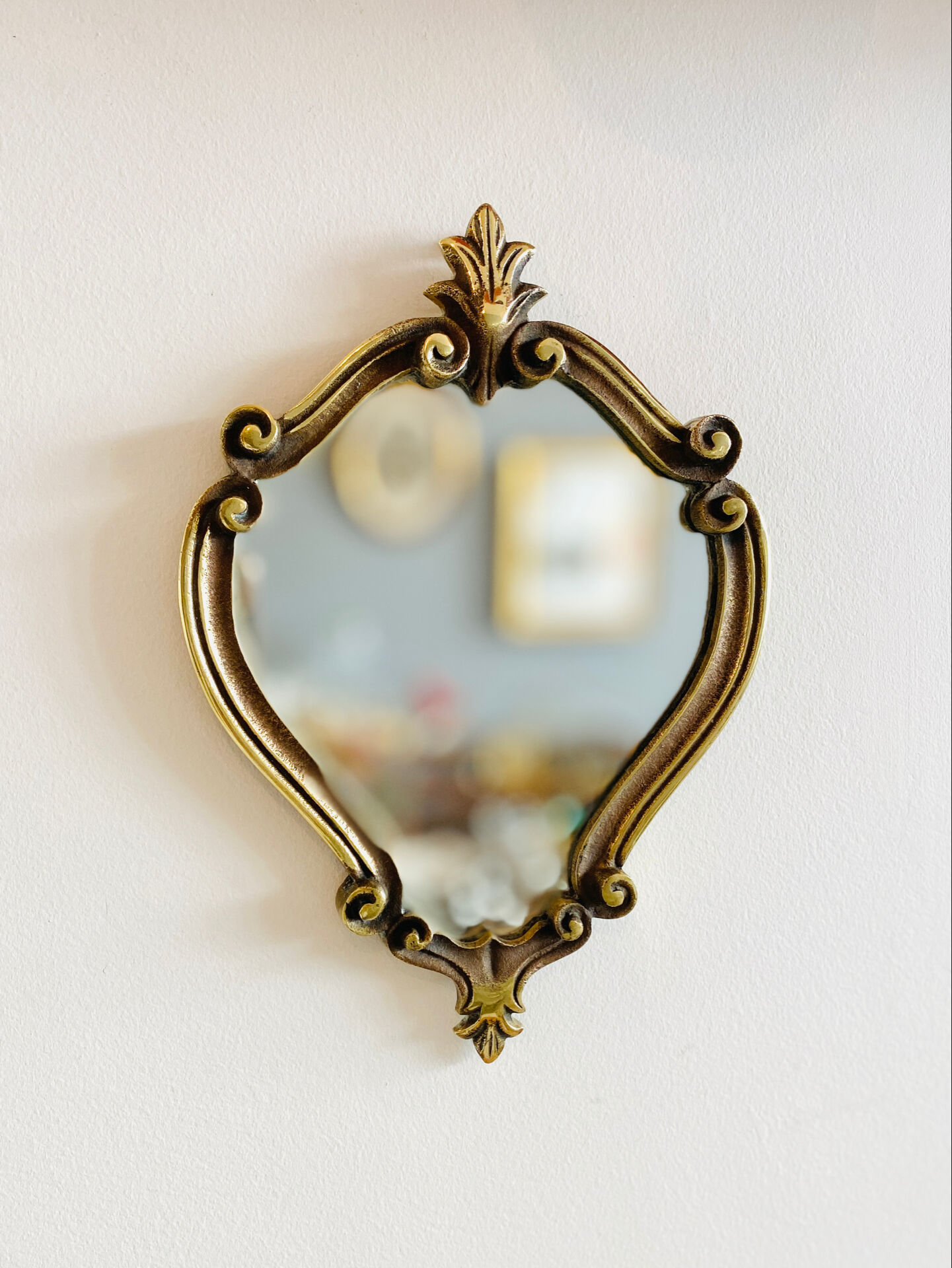 Small antique mirror in baroque style – gold frame in bronze or brass.