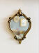 Small antique mirror in baroque style – gold frame in bronze or brass.