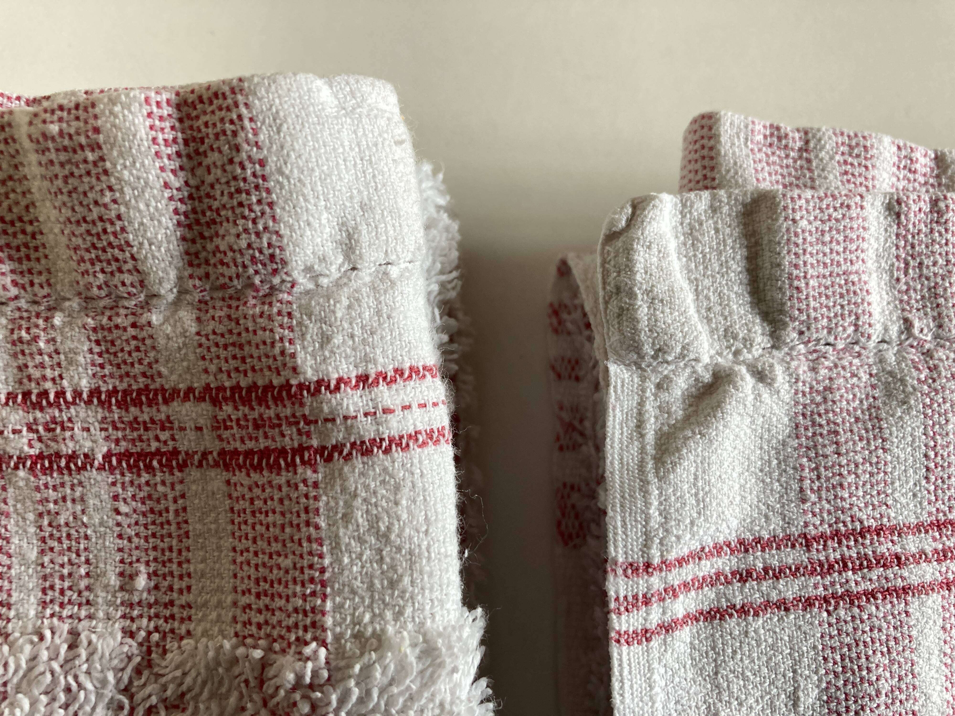 Pair of 1950 red woven kit towels