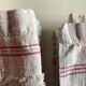 Pair of 1950 red woven kit towels