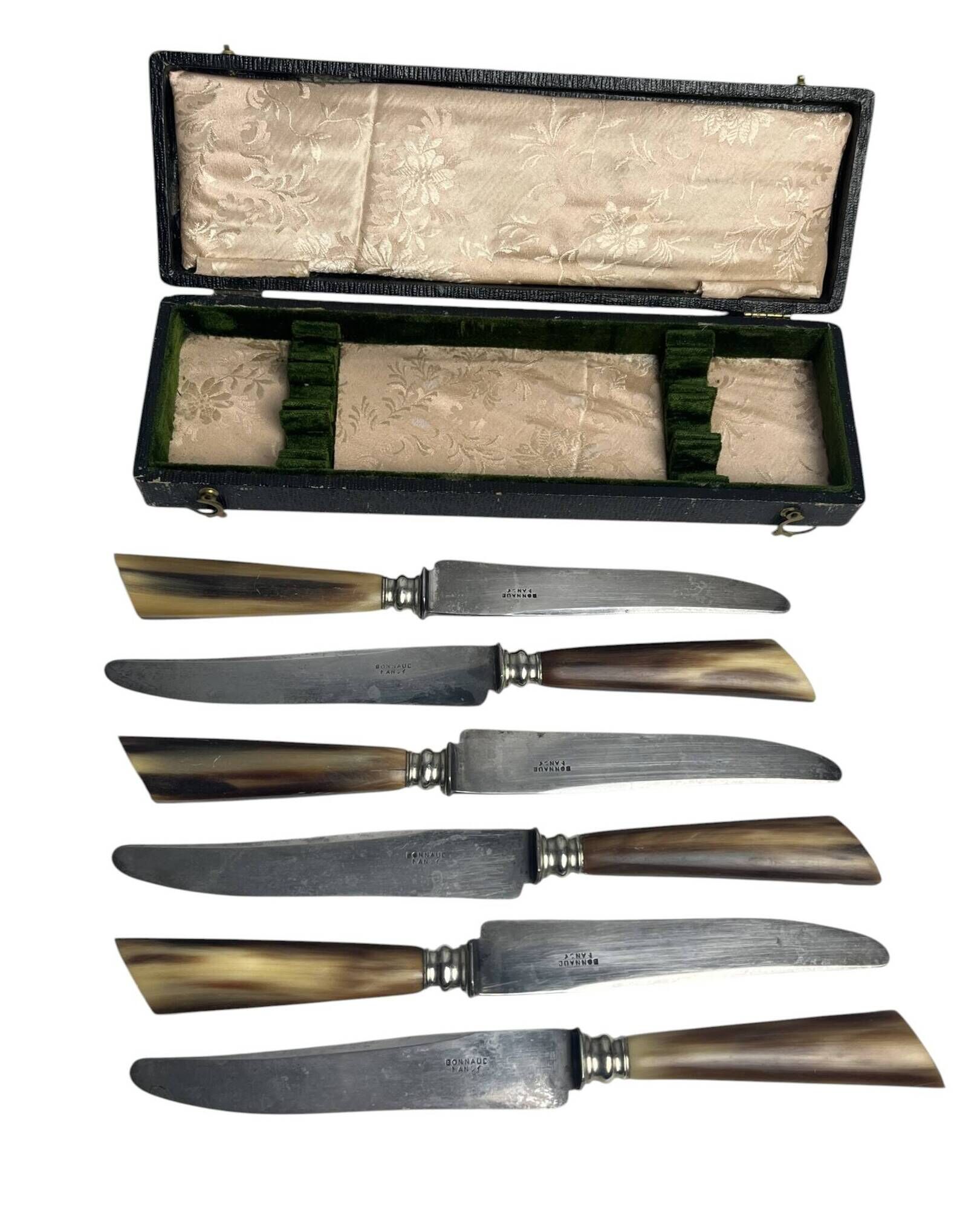 Six knives with steel blades and horn handles, Bonnaud Nancy, early 20th century.