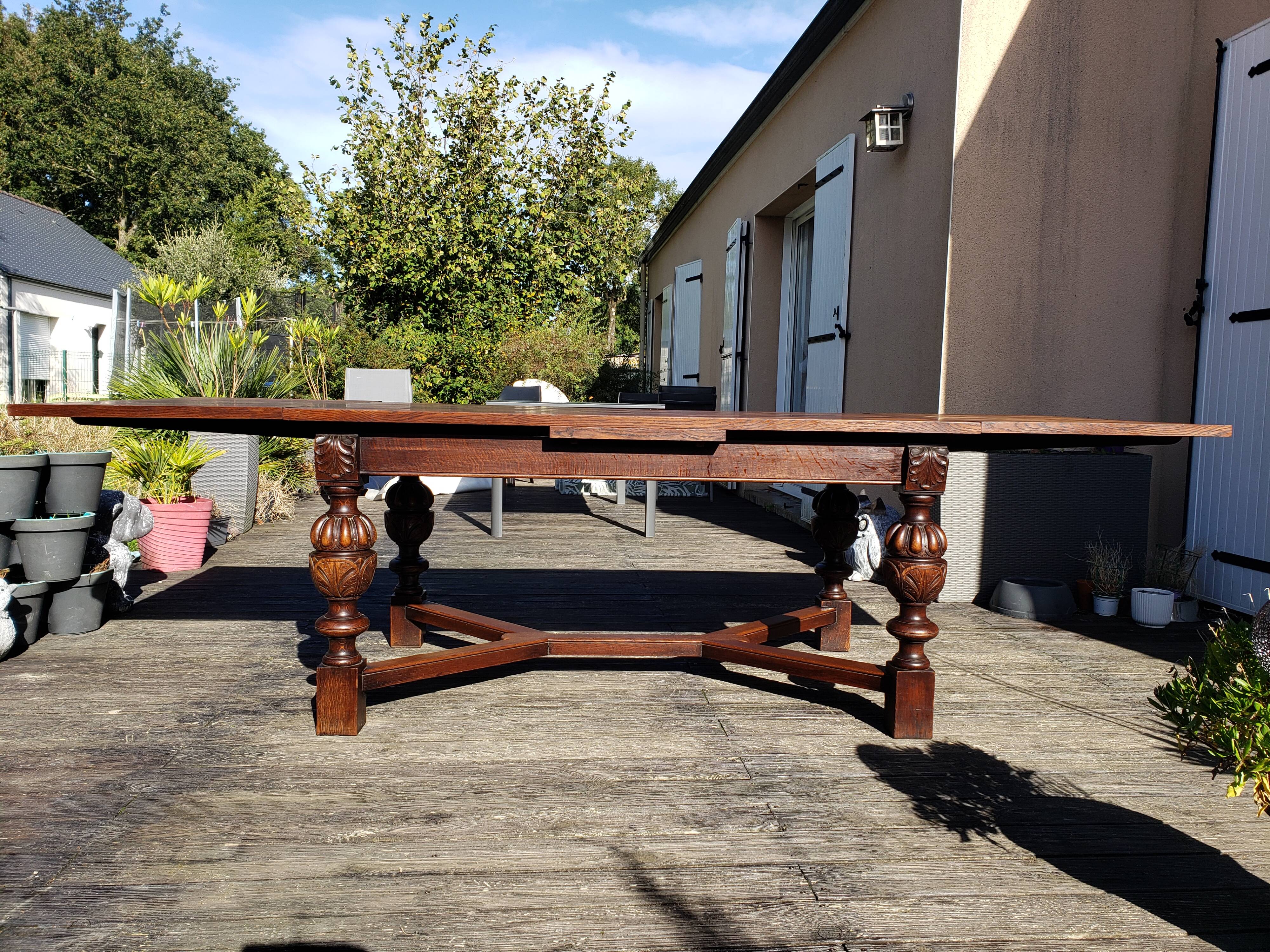 1910s Jacobean style solid oak extending drawer dining table