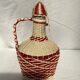 Dame jeanne bonbonne en plastique blanche et rouge dimension : hauteur -25 cm-