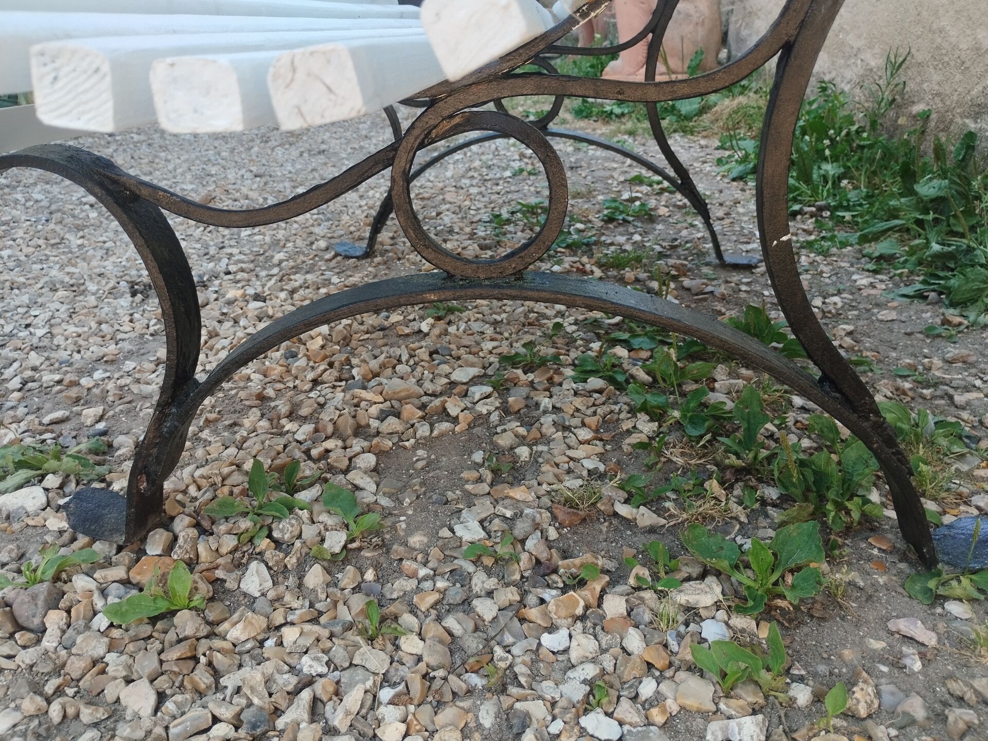 Antique garden bench with cast iron legs