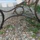Antique garden bench with cast iron legs