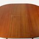 Round extendable dining table in teak – 1960s