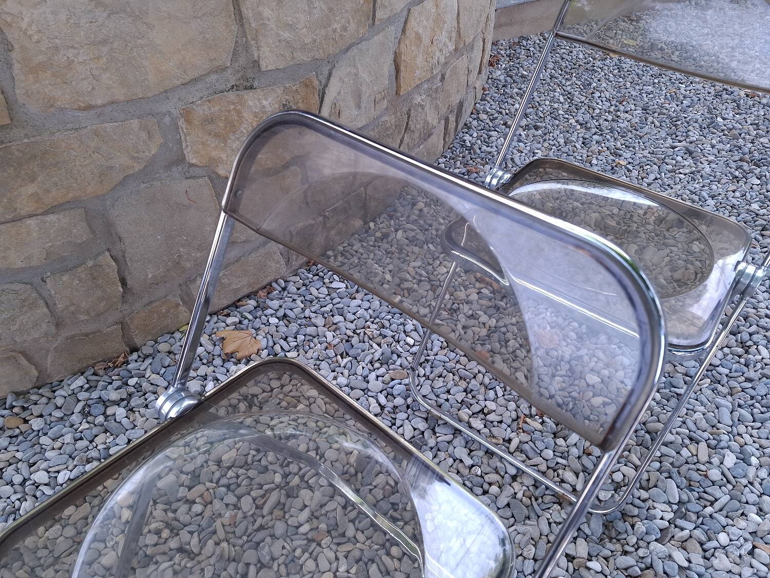 2 folding chairs designed by Giancarlo Piretti for Castelli