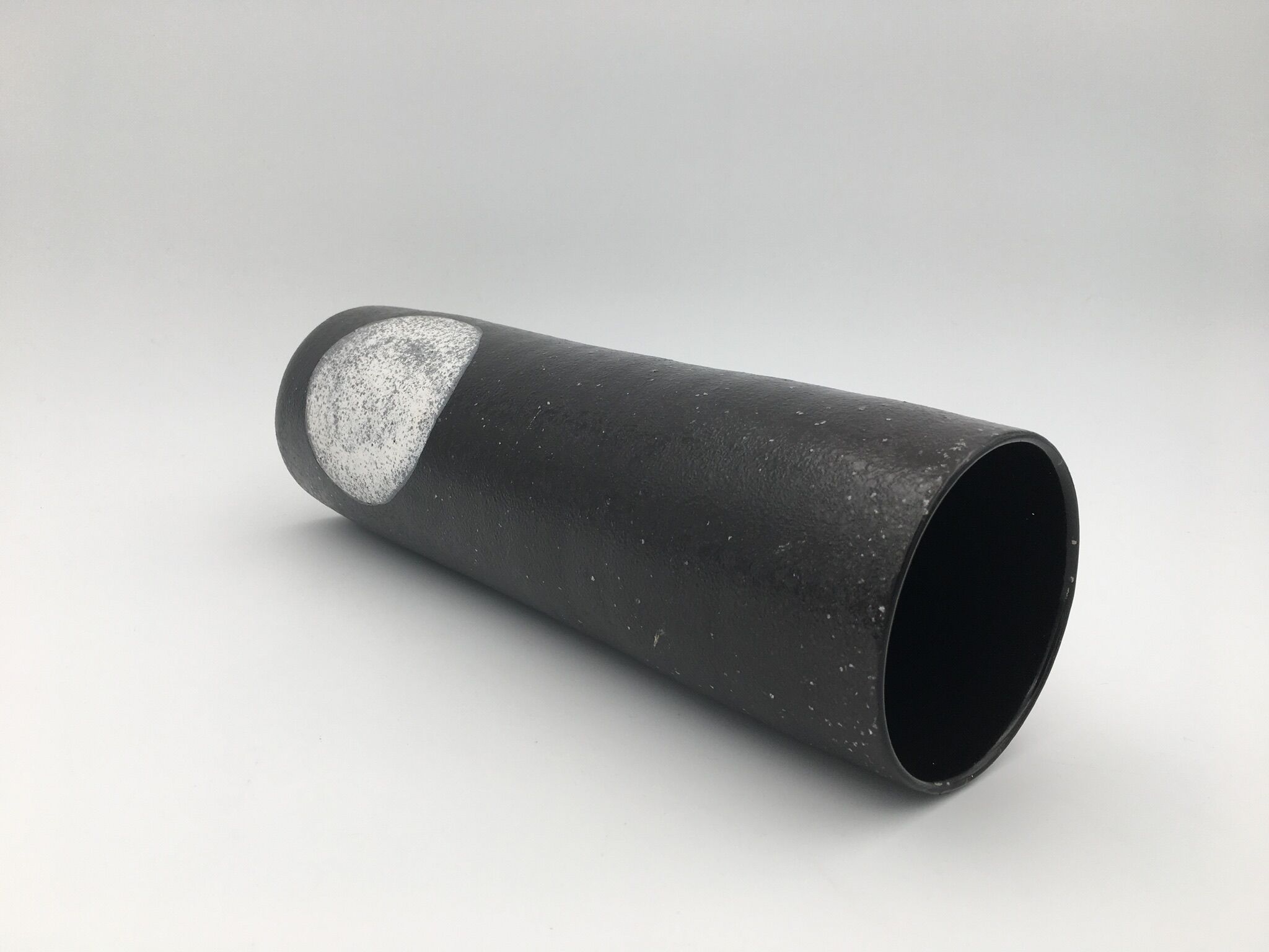Black ceramic roll vase, decorated with a white circle, design - 20th century